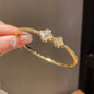 Gold Tone Crystal Flower Bangle Bracelet
